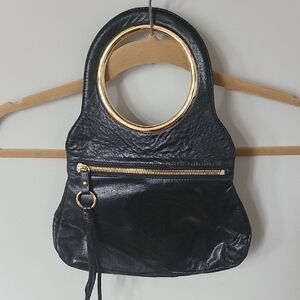 HOBO Black Leather Handbag with Gold Ring Handle and Accents